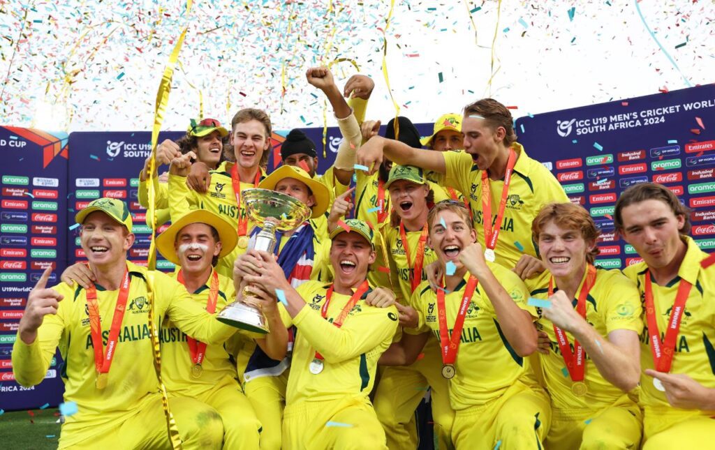 Australian under 19 team posing with trophy after winning the world cup final